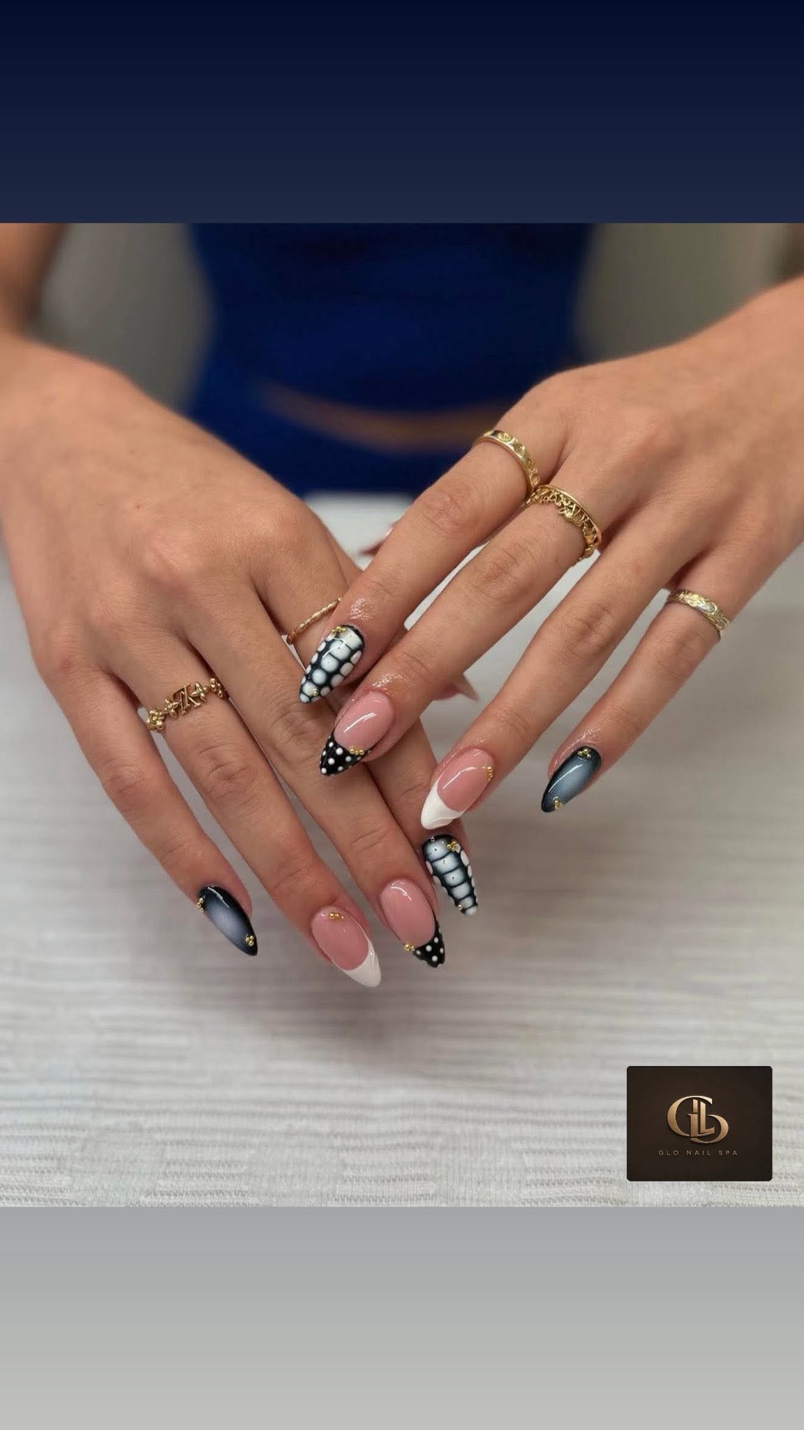 Black, white, and gold detailed manicure