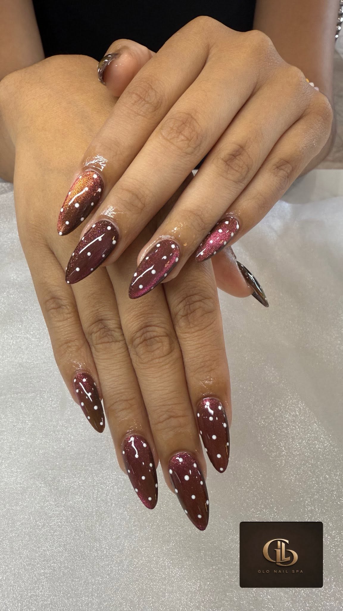 Wine shimmer almond nails created at Glo Nail Spa